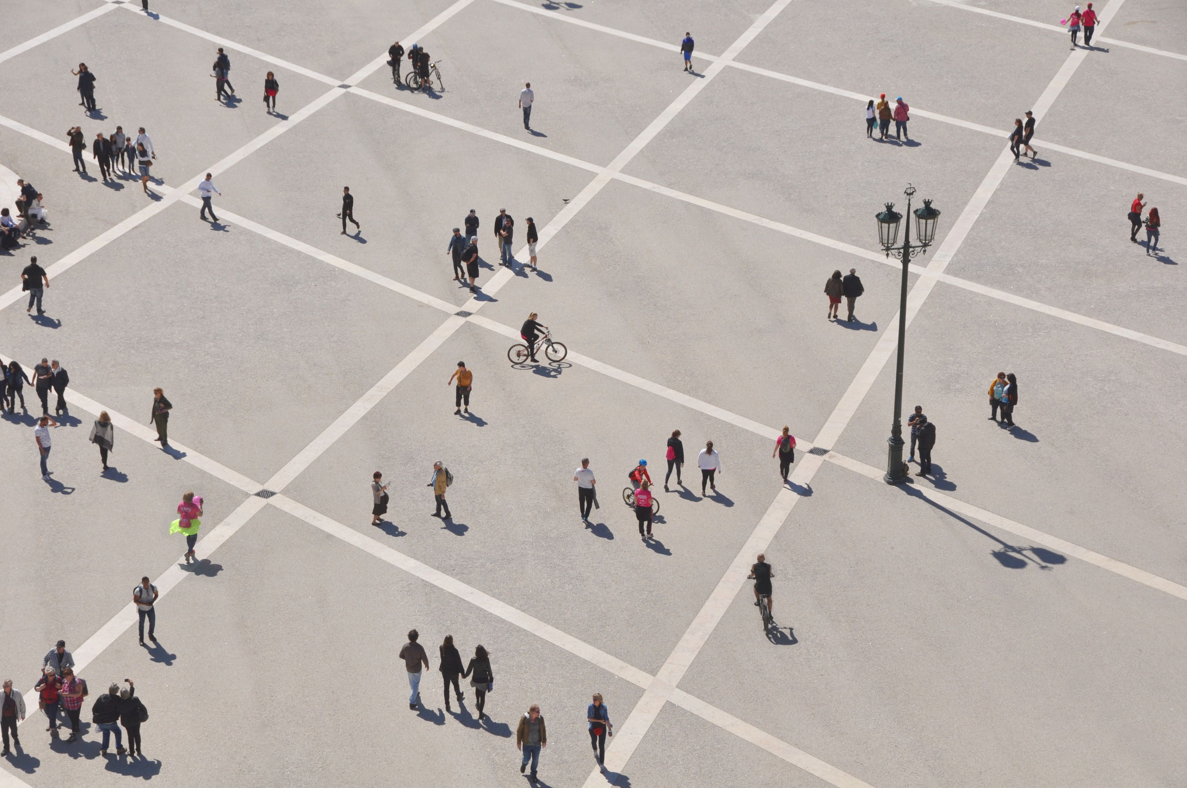group of people walking on pedestrian lane